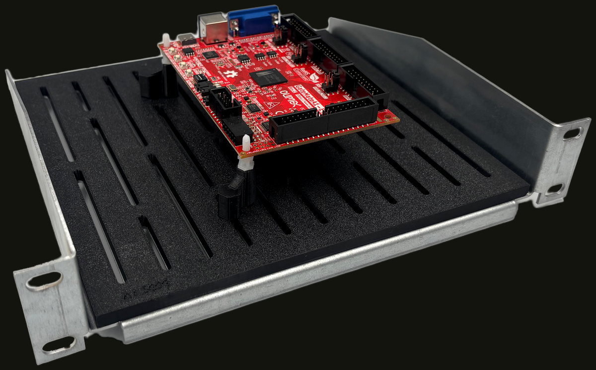 Three-quarter view of the shelf with a PCB seated on the mounting posts