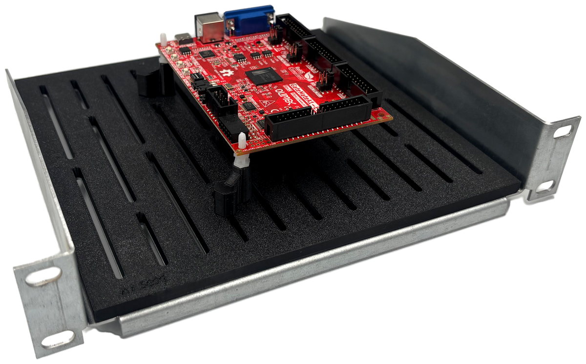 Three-quarter view of the shelf with a PCB seated on the mounting posts